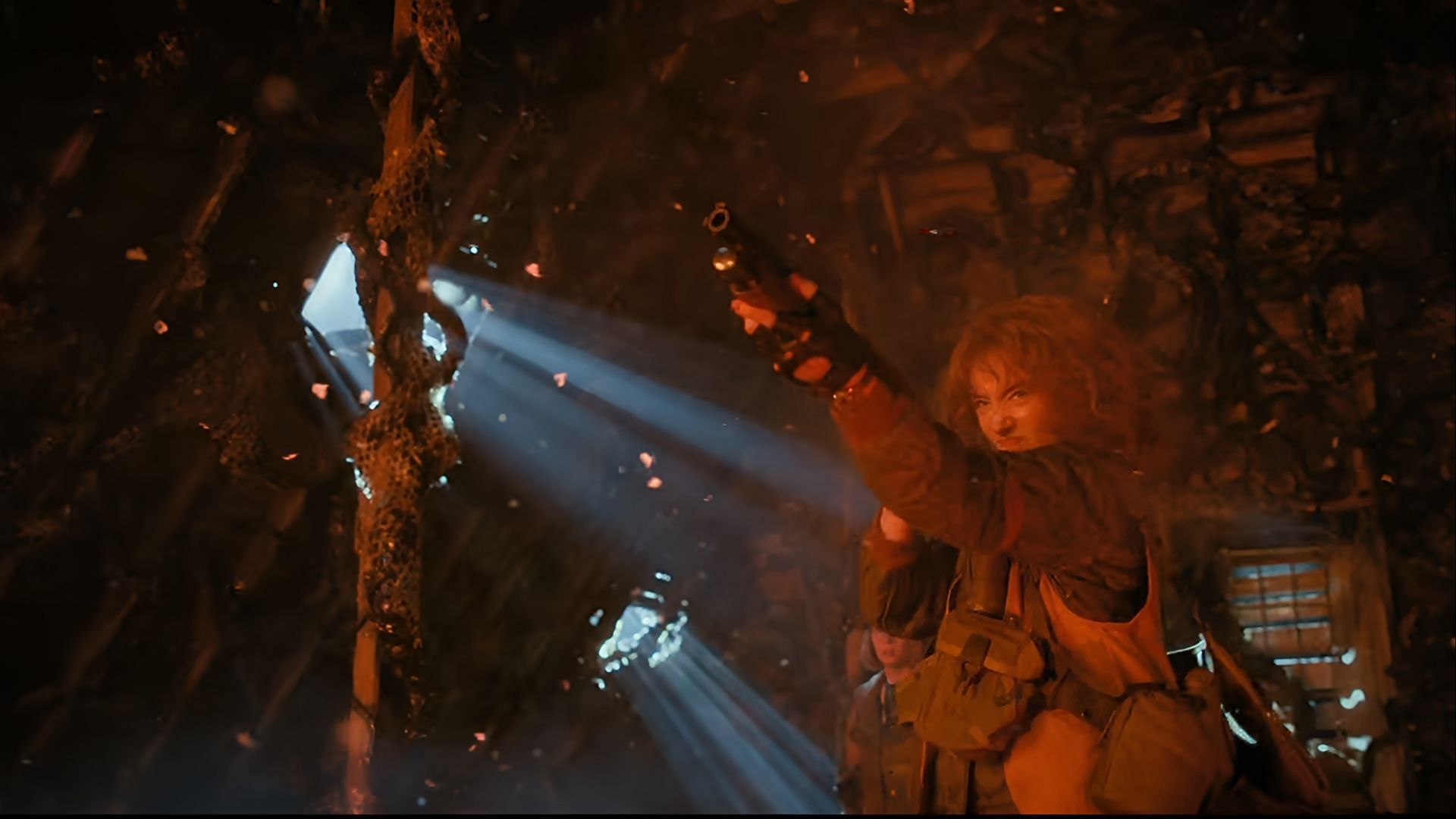 Nancy leads the resistance from the shadows in Stranger Things, refusing to surrender as the last flickers of rebellion fight to survive. (Image via Netflix)